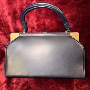 Vintage Elegant Black Leather Handbag
Vintage
Probably 50s or 60s